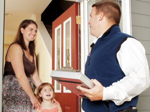 A Rose Pest employee is speaking with a homeowner and her daughter in Chicago, IL