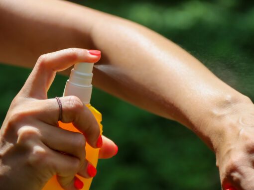 A Person Applying Insect Repellent